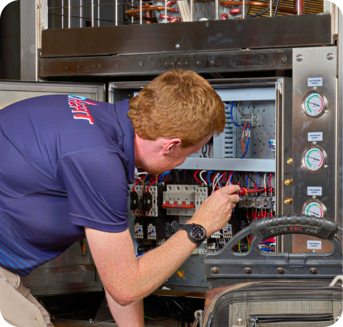 EvoHeat technician servicing a commercial heat pump unit