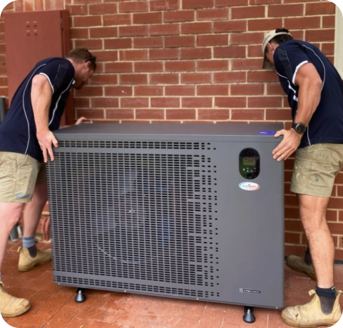 EvoHeat installers positioning a residential pool heat pump