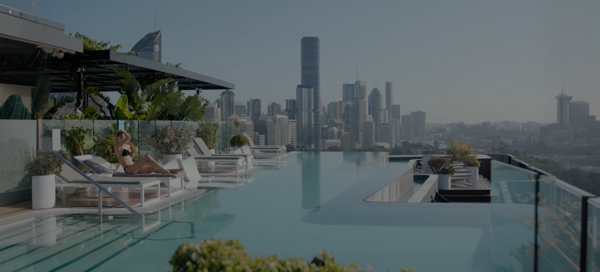 Rooftop infinity pool heated by EvoHeat overlooking the Brisbane skyline