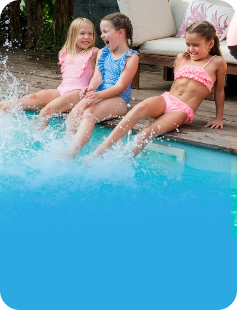 Family playing in a heated pool