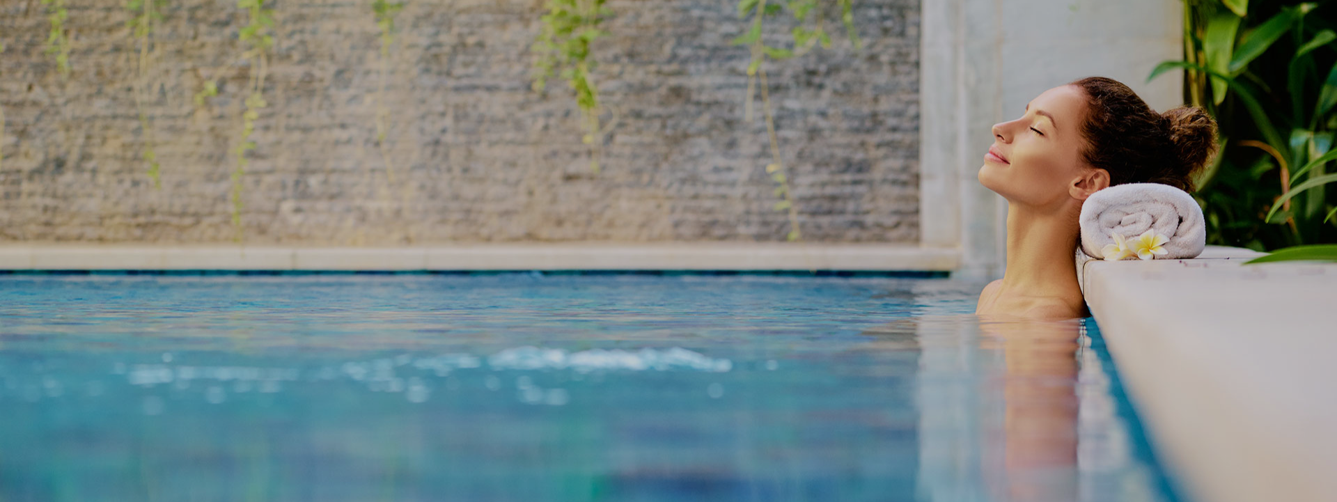 Woman relaxing in a heated spa